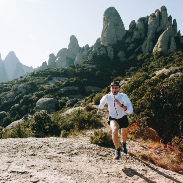 Cool man with tattoos ultra trail runner